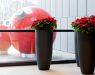 Additional ornaments of the decoration are graphite planters with red poinsettias