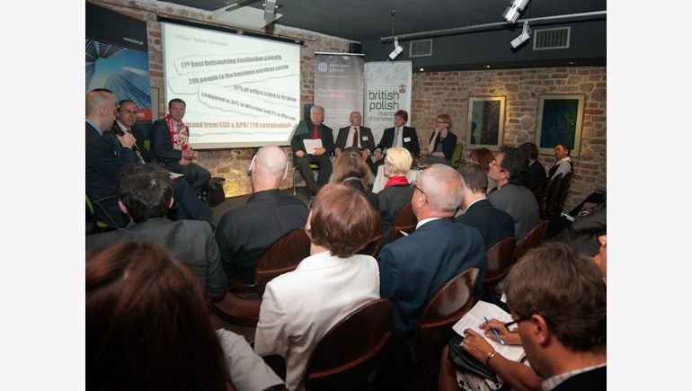 A picture of the participants of the meeting during a debate