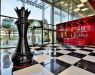 Main hall in the form of a large chessboard made from black and milky stone