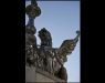 The name of tenement house descend from sculptures on the roof's corners