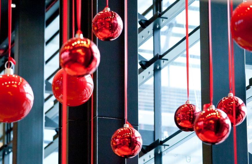  - Christmas balls are hung on both sides of a three-storey high main hall